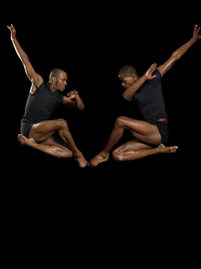 Two Male Dancers Jumping Photograph by Image Source
