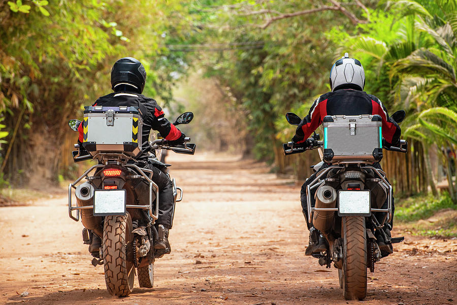 Jungle Photograph - Two Men Riding Their Adventure Motorbike On Dirt Road In Cambodia by Cavan Images