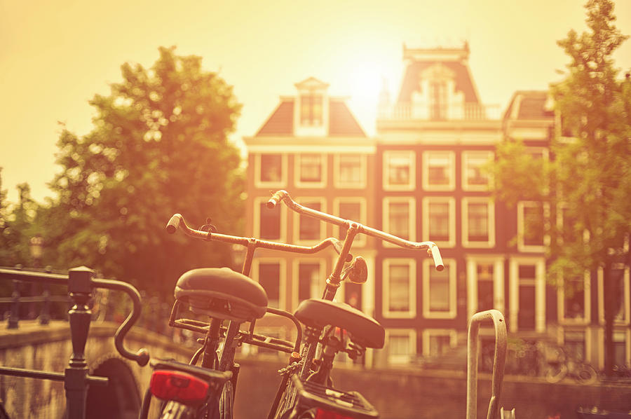 Two Old Bicycles In Amsterdam At Sunset Photograph by Cirano83