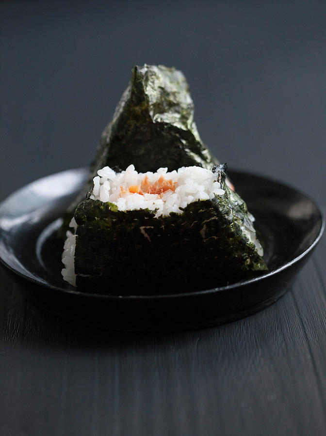 Two Onigiri Filled With Salmon, One Bitten japan Photograph by Martina Schindler
