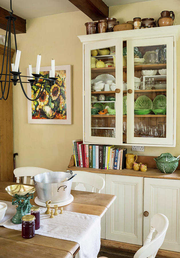Two-part Dresser And Dining Table In Rustic Kitchen Photograph by Brian Harrison