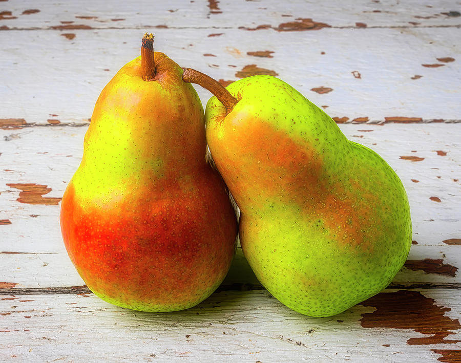 Two Pears Leaning On Each Other Photograph by Garry Gay