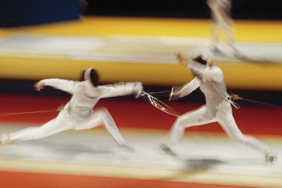 Two People Fencing Blurred Motion Photograph by David Madison