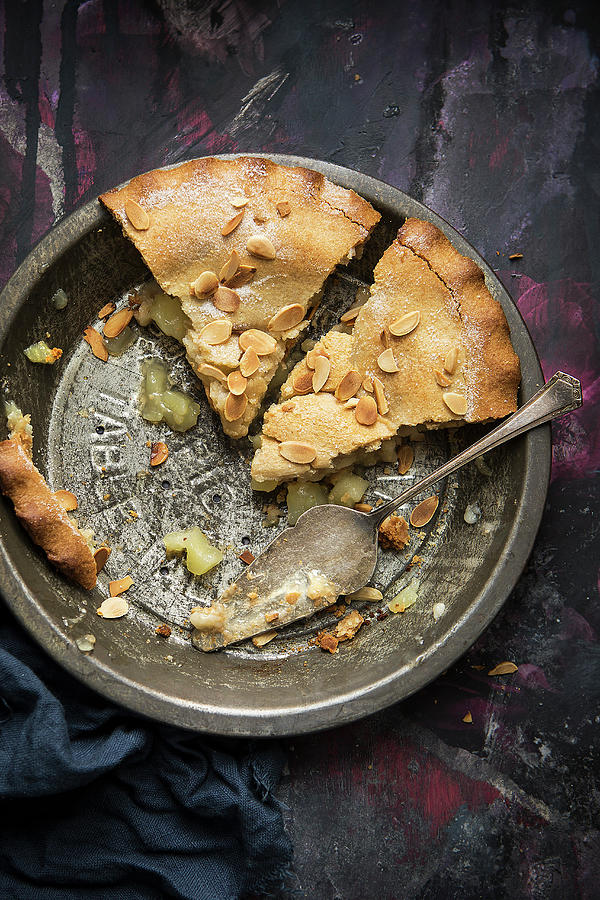 Two Pieces Of Apple Pie With Almonds In A Vintage Baking Dish top View Photograph by Stacy Grant