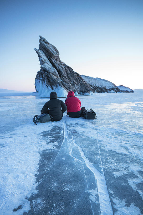 Winter Photograph - Two Pohotographers Waiting For The Sunset In Baikal Lake. by Cavan Images