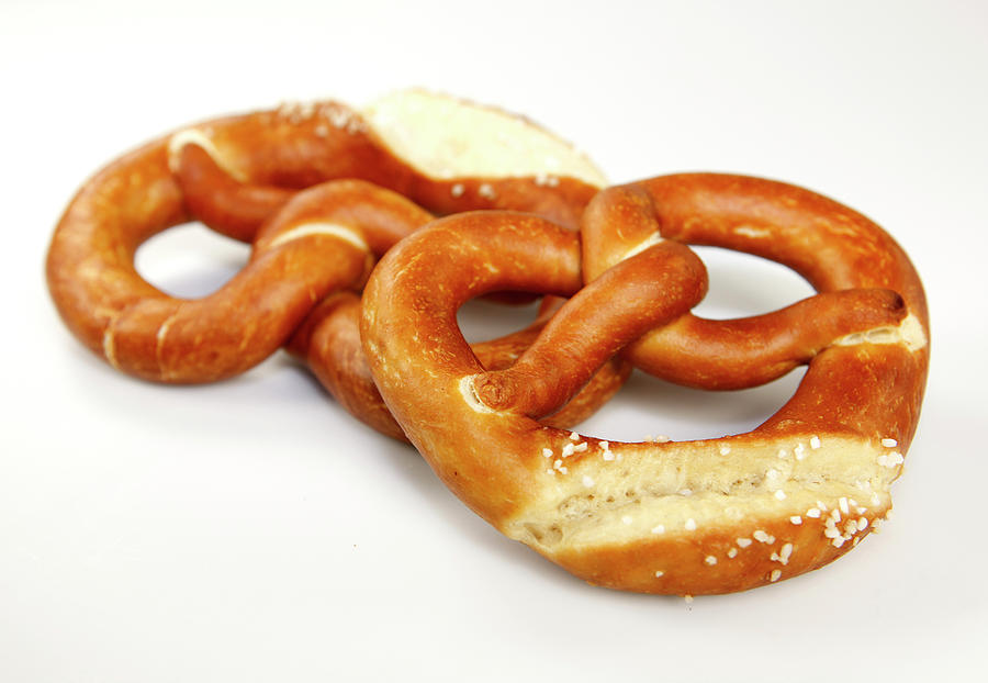 Two Pretzels On White Background Photograph by Jalag-fotostudio - Fine ...