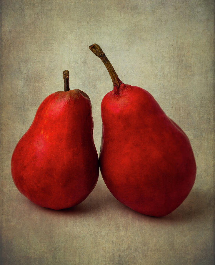 Two Red Pears Leaning On Each Other Photograph by Garry Gay