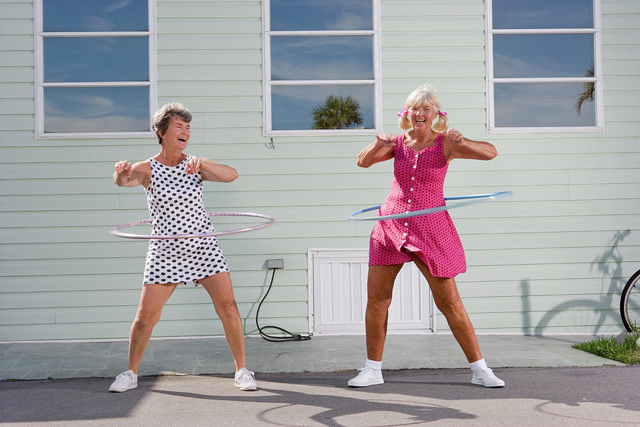 Two Senior Women Playing With Plastic Photograph by Greg Ceo Two Senior Women Playing With Plastic Photograph by Greg Ceo