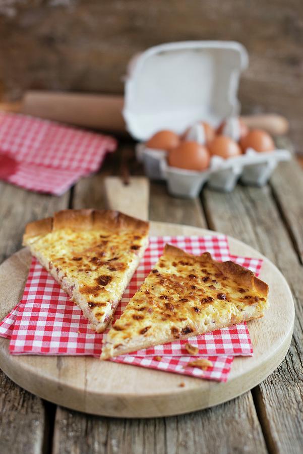 Two Slices Of Quiche Lorraine With Napkins On A Wooden Board Photograph by Sonia Chatelain