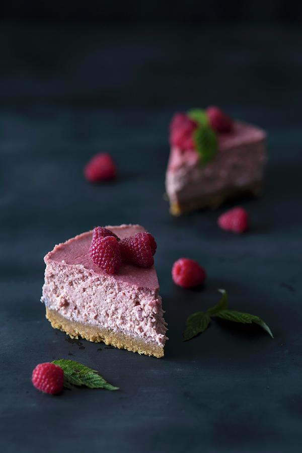 Two Slices Of Raspberry Cheesecake Photograph by Malgorzata Laniak