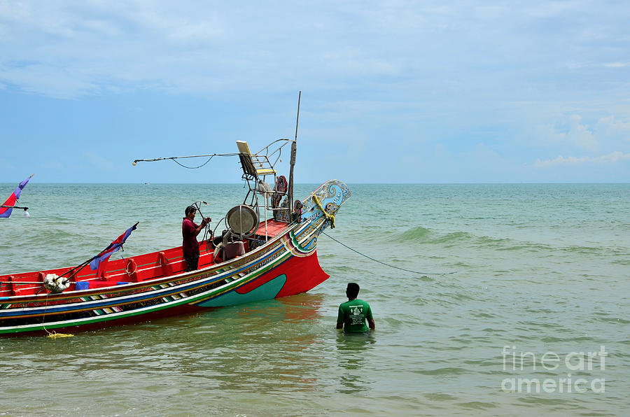 Two Thai fishermen prepare boat with anchor at seaside Pattani Thailand Photograph by Imran Ahmed