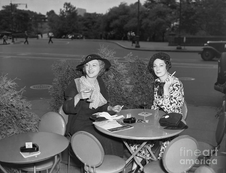Two Women Drinking At Sidewalk Cafe Photograph by Bettmann