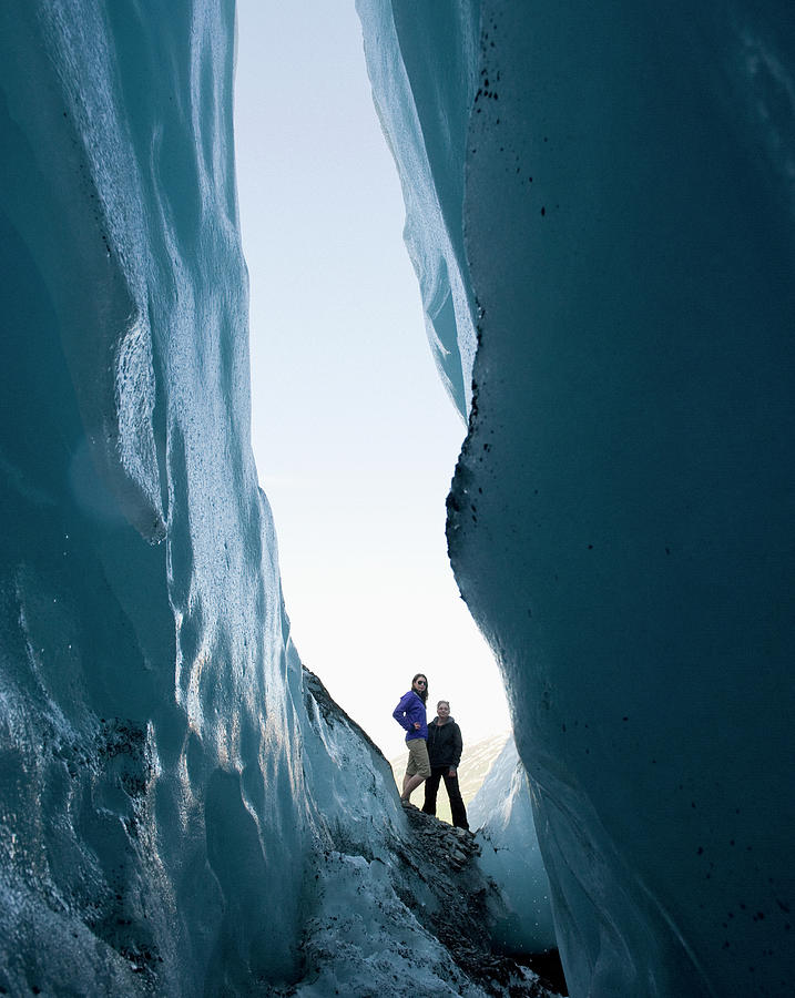 Two Women Stand Looking Into Crevasse Photograph by Brian Caissie