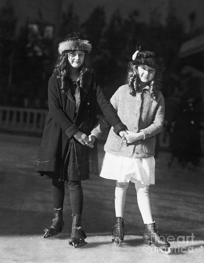 Two Young Girls Ice Skating Photograph by Bettmann