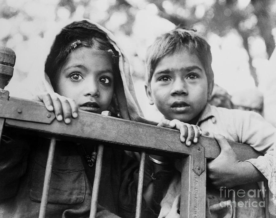 Two Young Indian Children Holding Photograph by Bettmann