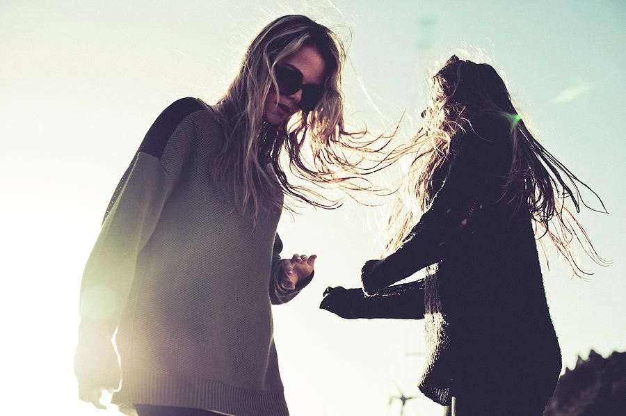 Two Young Indie Girls Dancing In The Sun Photograph by Mareea Vegas