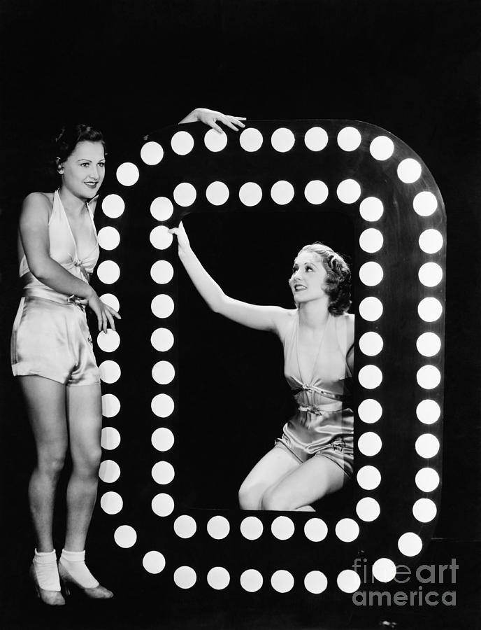Looking Away Photograph - Two Young Women Posing With The Letter O by Everett Collection Looking Away Photograph - Two Young Women Posing With The Letter O by Everett Collection