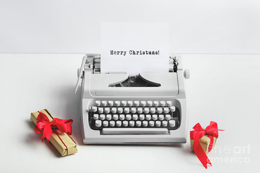 Typewriter with MERRY CHRISTMAS text and gifts Photograph by Michal Bednarek