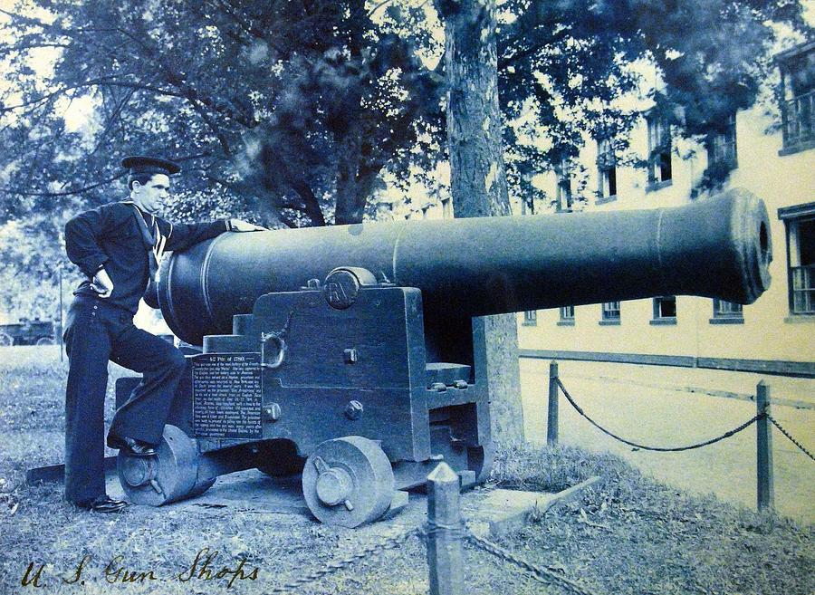U S  Navy sailor stands next to 42 pound cannon Painting by Celestial Images