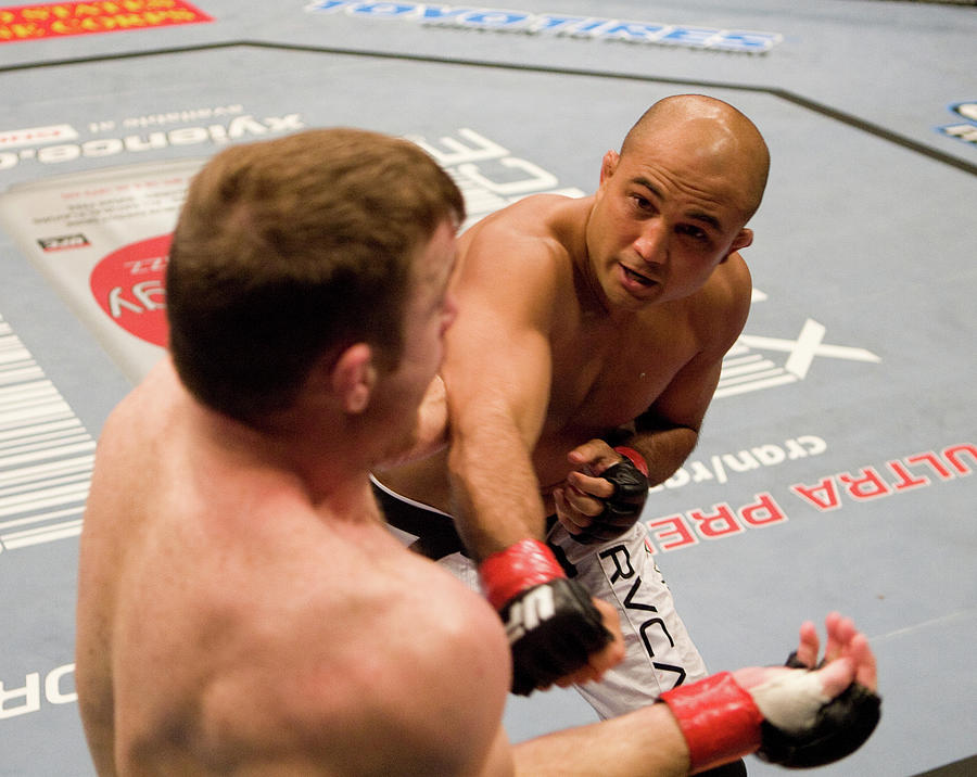 ANAHEIM - SEPTEMBER 23: (R-L) BJ Penn punches Matt Hughes at UFC 63 at the ...