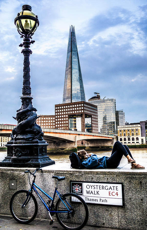 Uk, England, London, City Of London, Thames, The Shard, Girl Lying On The Wall By The River With Bicycle Digital Art by Antonino Bartuccio