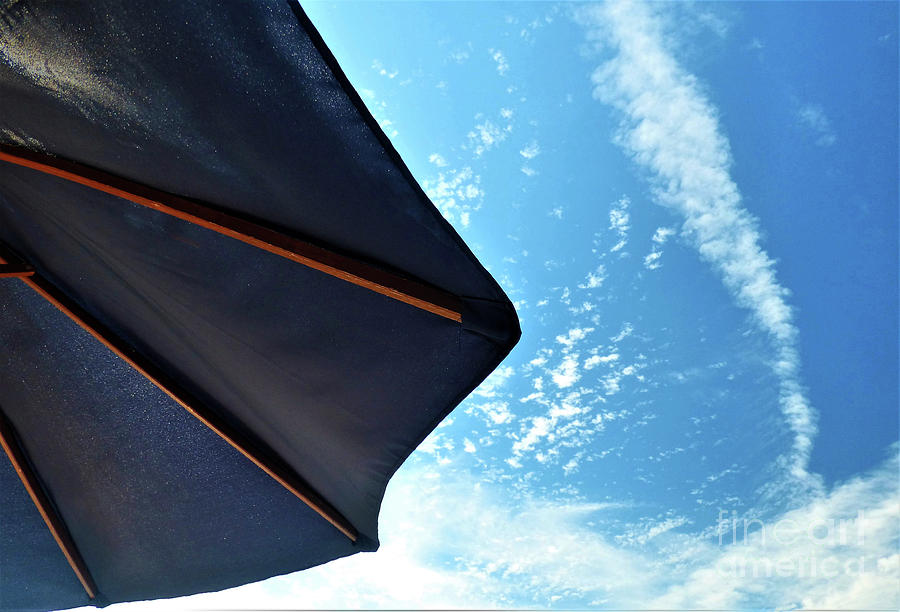 Umbrella And Blue Sky Photograph