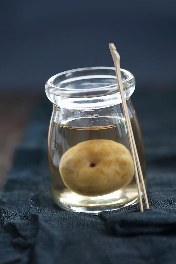 Ume Plums Preserved In Umeshu japanese Plum Liqueur Photograph by Martina Schindler