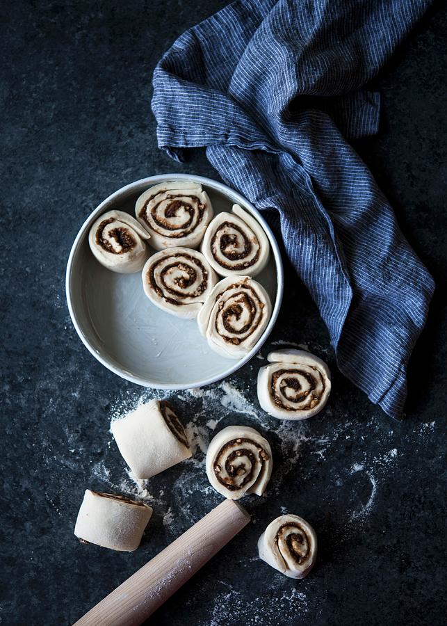 Unbaked Cinnamon Rolls In And Next To A Baking Tin Photograph by Lisa Rees