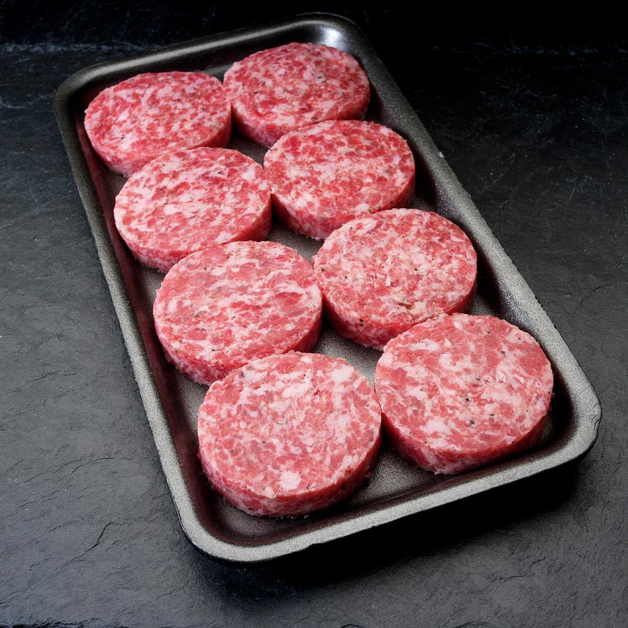 Uncooked Breakfast Pork Sausage Patties In Plastic Tray Photograph by Paul Poplis