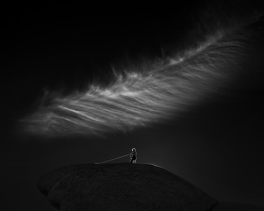 Under A Lonely Cloud Photograph by Shenshen Dou