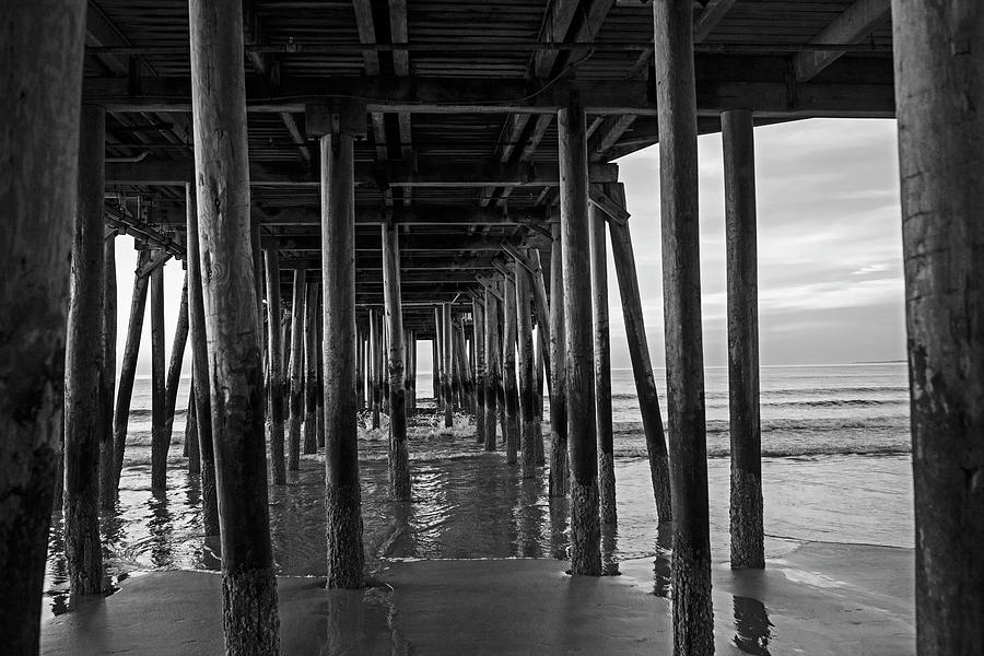 Under the Old Orchard Pier at Sunrise Maine Black and White Photograph by Toby McGuire