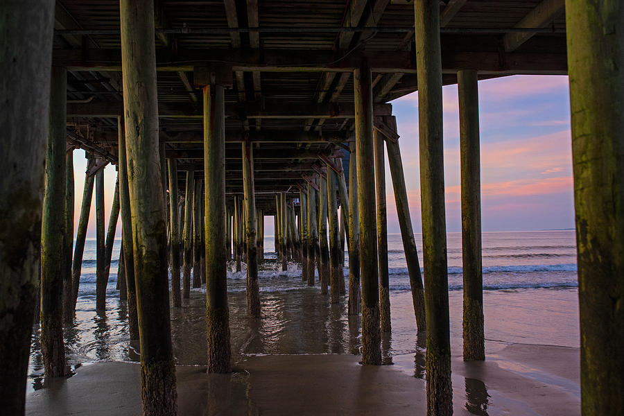 Under the Old Orchard Pier at Sunrise Maine Photograph by Toby McGuire
