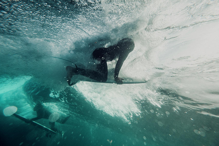 Underwater View Of Two Surfers In Action Photograph by Cavan Images