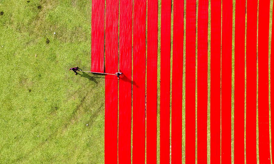 Unfurling Red Clothes Photograph by Mostafijur Rahman Nasim