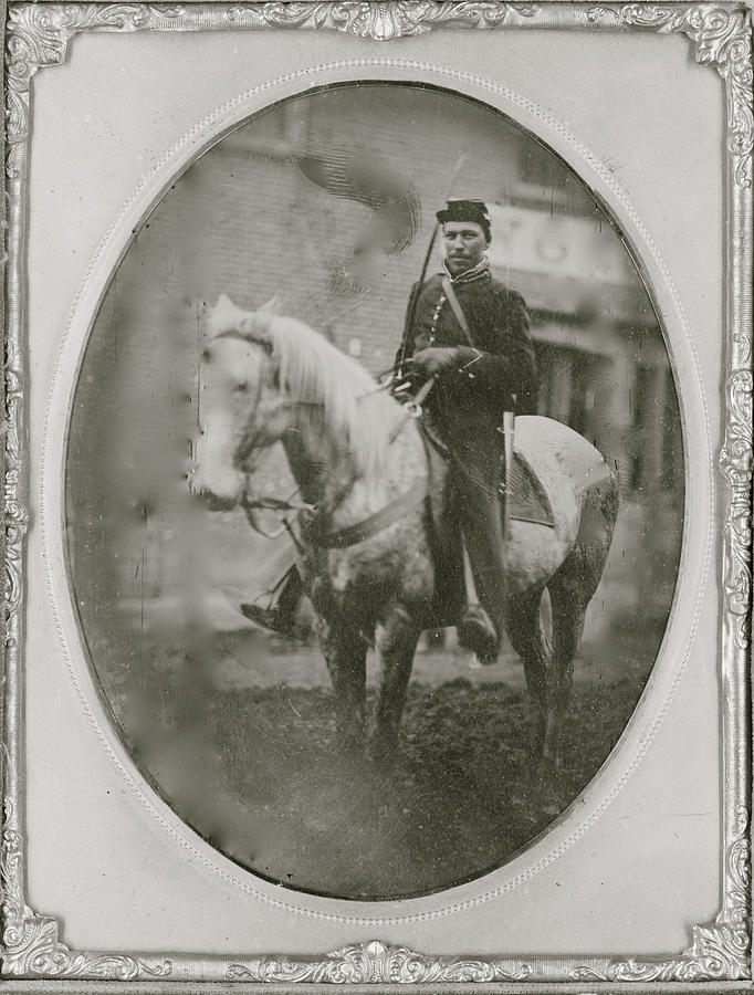 Unidentified African American soldier seated on horseback, facing left. Painting by Unknown