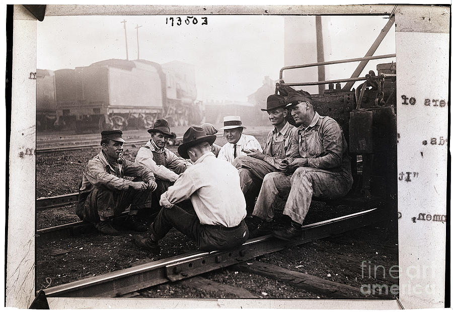 Union Men Talking In Train Yard Photograph by Bettmann Union Men Talking In Train Yard Photograph by Bettmann