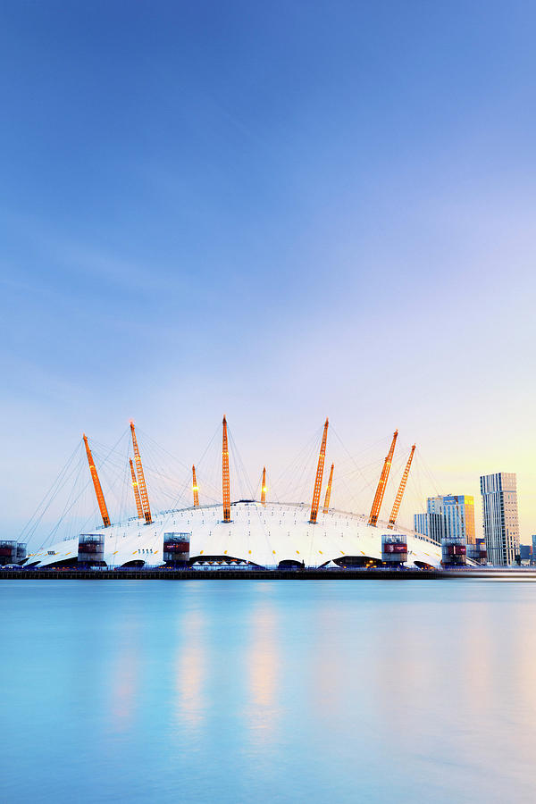 Architecture Digital Art - United Kingdom, England, London, Great Britain, Thames, Royal Borough Of Greenwich, 02 Arena In North Greenwich And Canary Wharf Buildings In The Background By Night by Maurizio Rellini