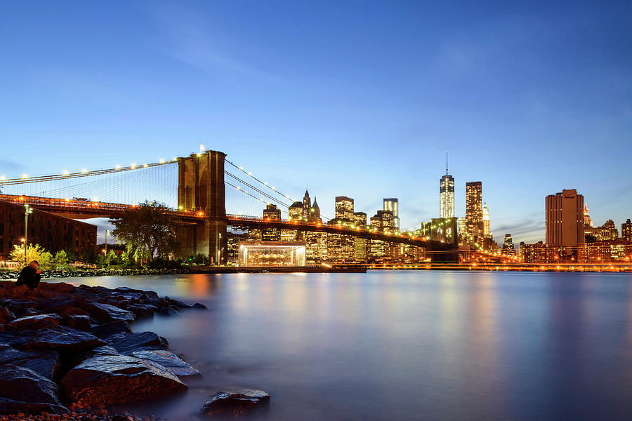 United States, New York City, Manhattan, Brooklyn Bridge, East River, Downtown Manhattan Skyline With Freedom Tower And Brooklyn Bridge Illuminated At Dusk Digital Art by Claudio Cassaro