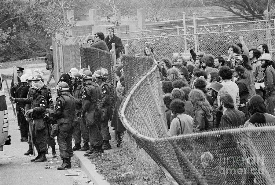 Unruly Protesting Crowd Damaging Fencing Photograph by Bettmann