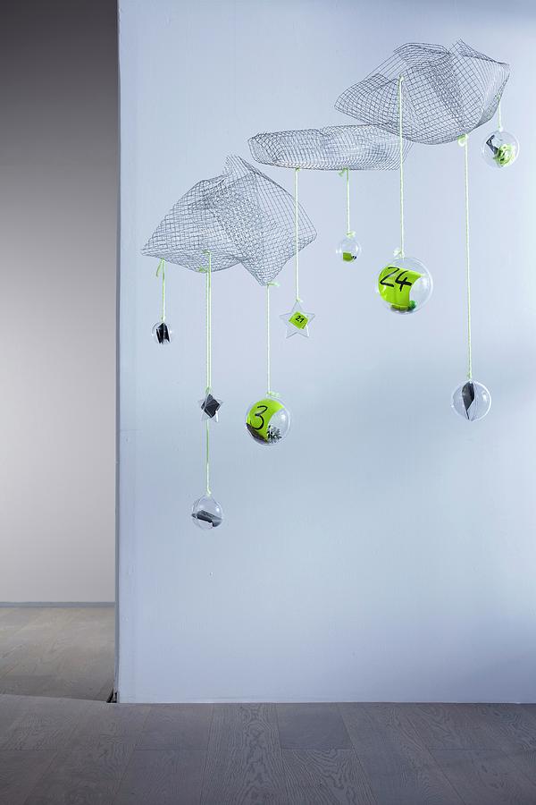 Unusual Advent Calender - Numbered Baubles Suspended From Floating Wire Mesh Shapes Photograph by Bodo Mertoglu