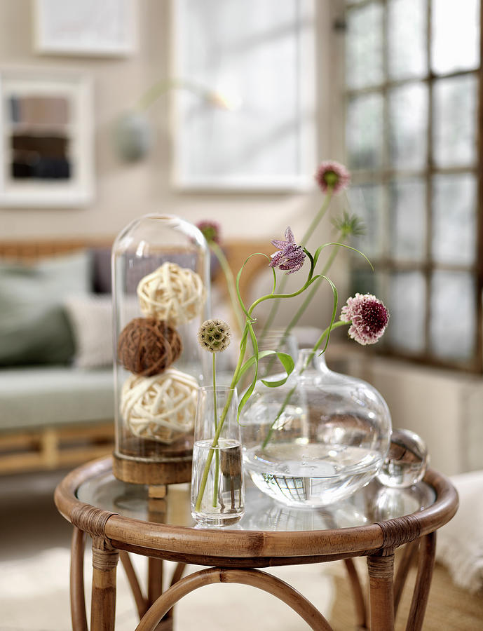 Unusual Flowers In Glass Vases On Rattan Table Photograph by Anderson Karl