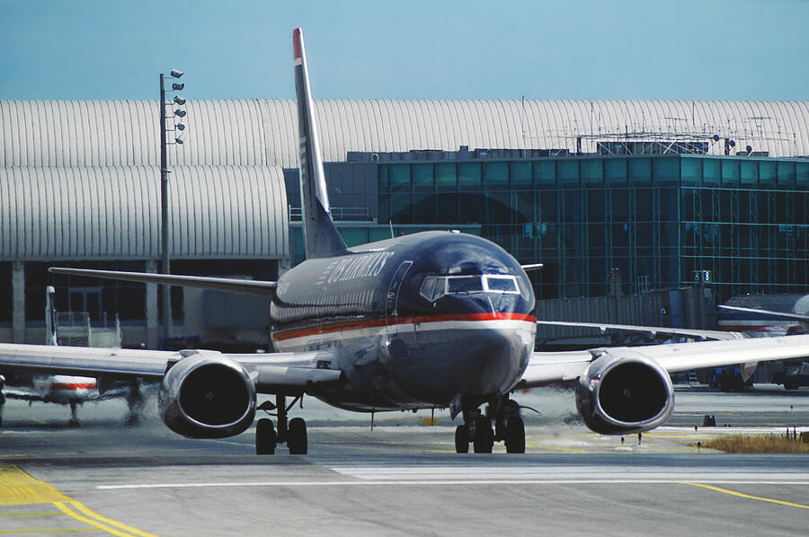 US Airways Boeing 737 at Orange County Airport Photograph by Erik Simonsen