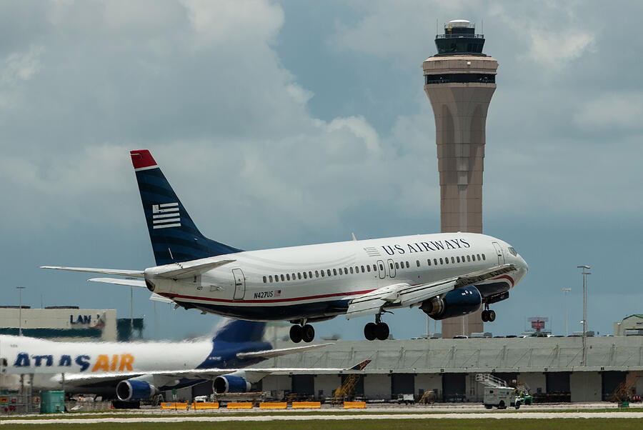 US Airways Boeing 737 Landing at Miami Photograph by Erik Simonsen