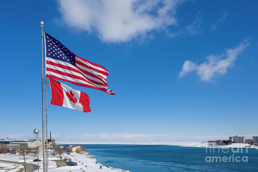 Us And Canadian Flags At Us-canada Border Photograph by Jim West/science Photo Library
