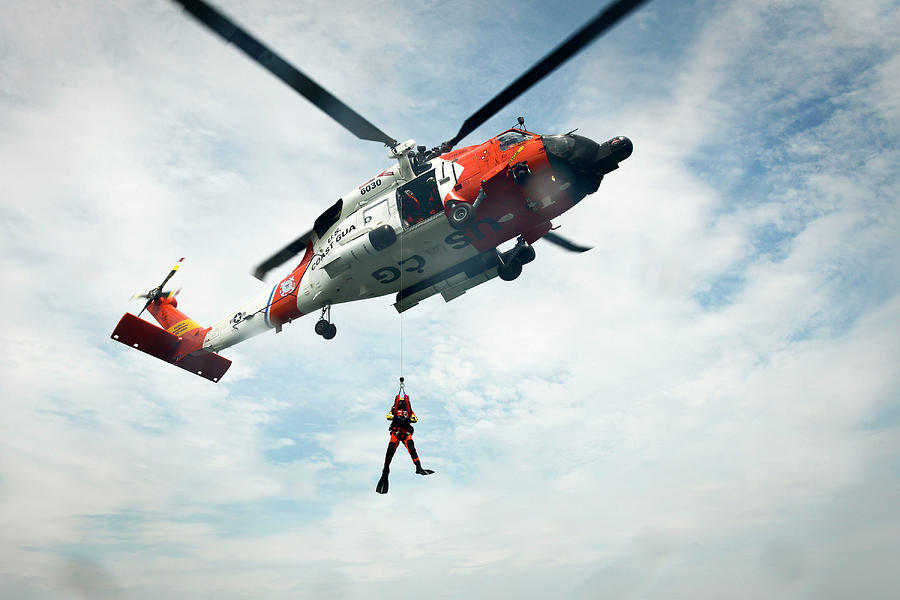 U.s. Coast Guard Conducts Hoist Photograph by Stocktrek Images