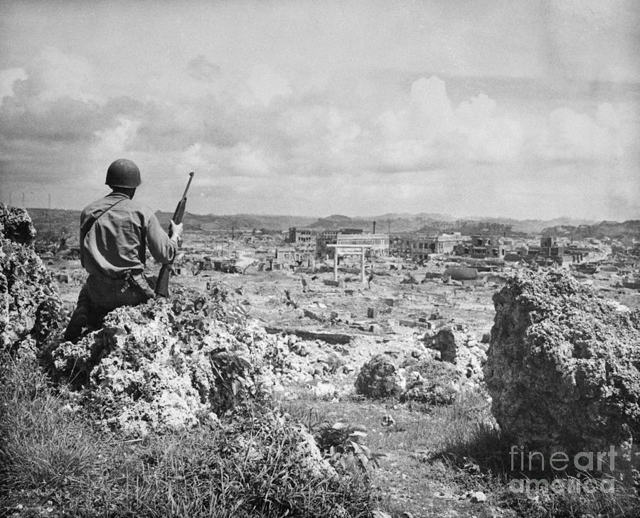 Us Marine Looks Over Destroyed City Photograph by Bettmann