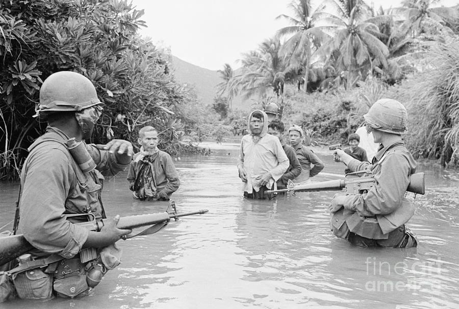 U.s. Troops And Prisoners Wade In Stream Photograph by Bettmann