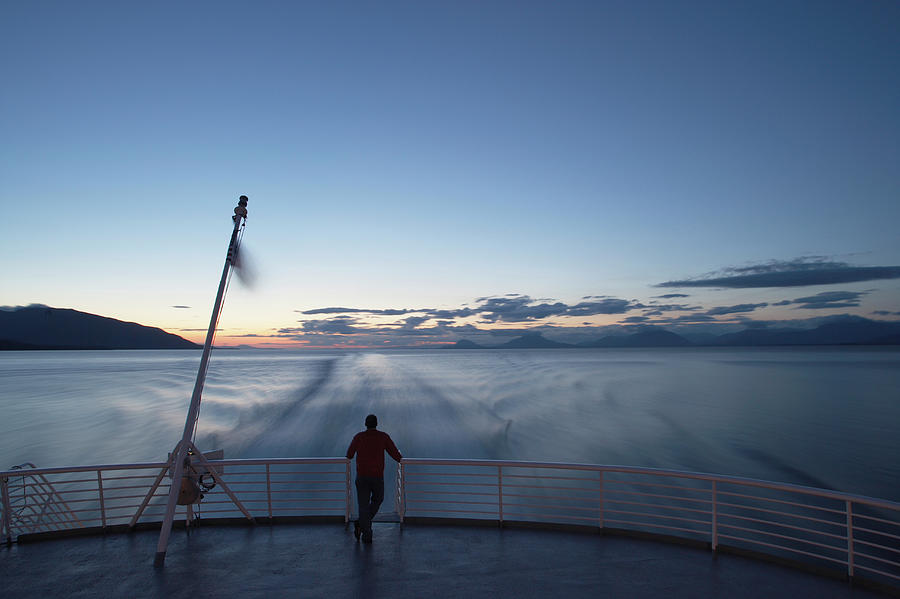 Usa, Alaska, Man Standing On Back Of Photograph by Paul Souders