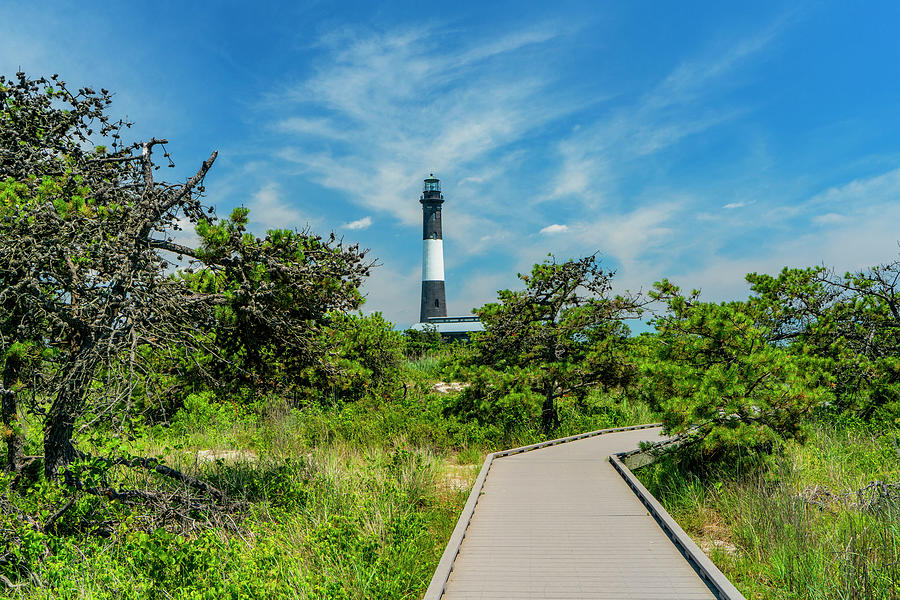 Usa, New York, Long Island, Wooden Path To Fire Island Lighthouse Surrounded By Tall Grass. Digital Art by Alejandra Uribe Posada