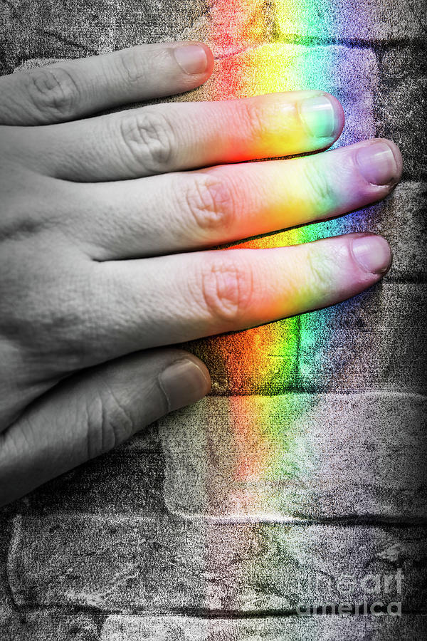 Using senses sensory perception with finger and rainbow light Photograph by Gregory DUBUS